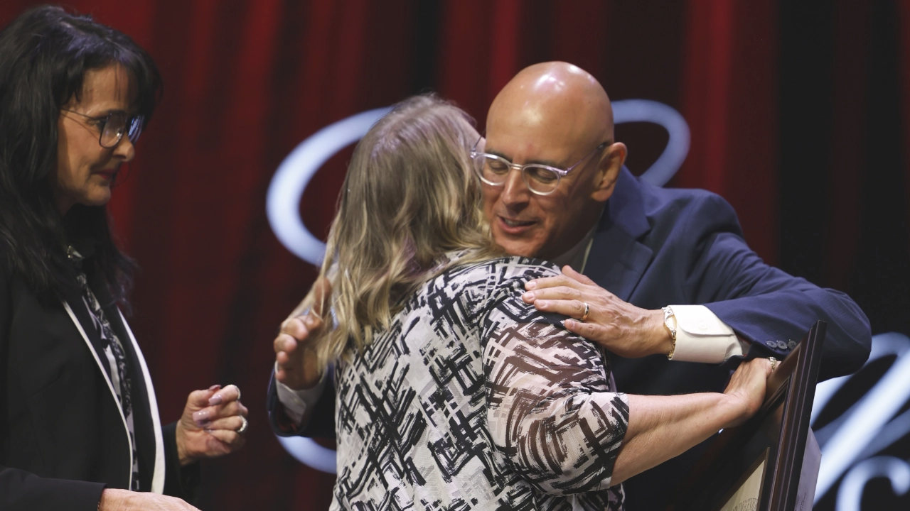todd smith hugging graduates
